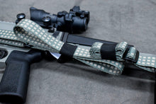 Load image into Gallery viewer, Secure the slack of your sling, and stage your sling for use.